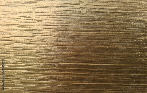 Golden wood plank photo, slightly blurred image for product placement as background illustration.