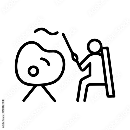 Person playing musical instrument while seated in a creative space  