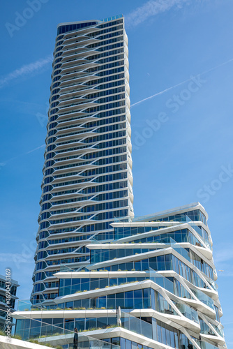 Vertical architectural detail of the Lighthouse skyscraper in Aarhus, Denmark, highlighting glass facade, modern lines, and contemporary urban design.