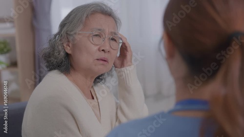 Wallpaper Mural Young Asian female care nurse gives advice to elderly woman health problems. Male doctor consulting patient, clinic room for medical care, getting health advice, discussing treatment plan, explaining Torontodigital.ca