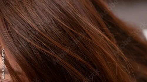 Close up of flowing brown hair displaying texture and natural light