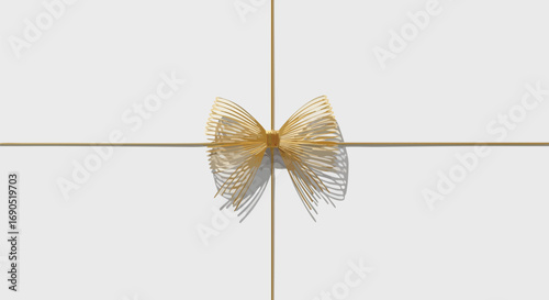 Elegant golden wire bow on white background for sophisticated gift or festive celebration design element