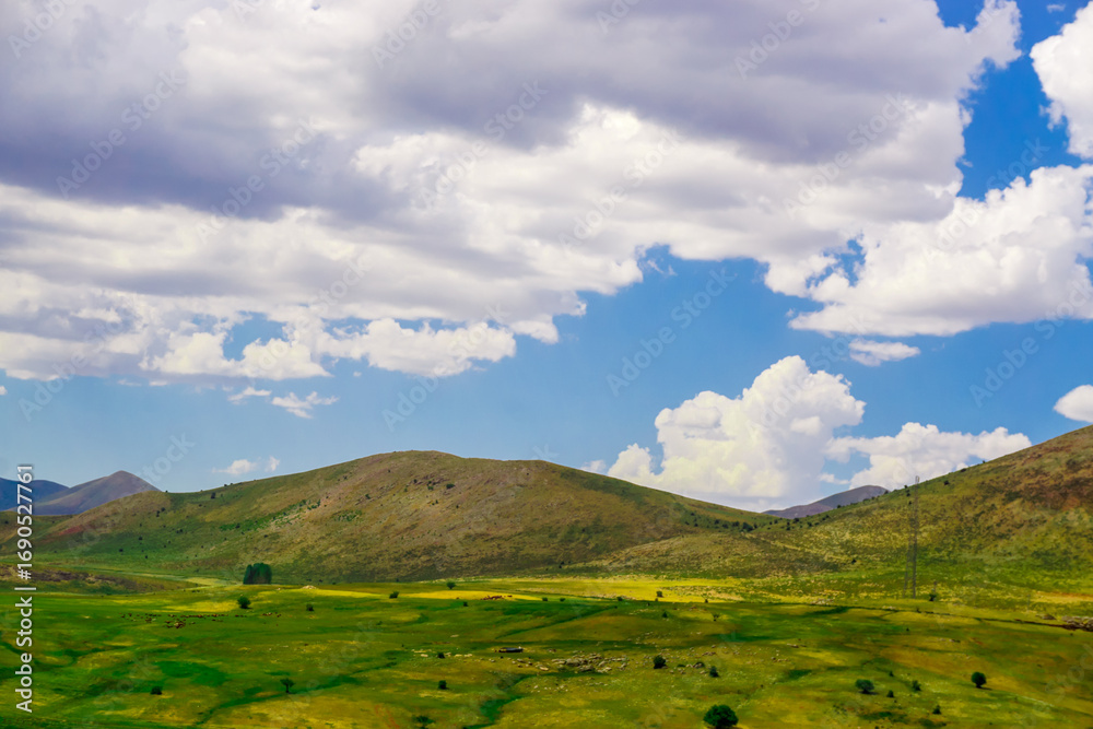 Obraz premium Beautiful Scenic Meadows and Fields on Erzurum Cat district in Turkey on a cloudy day