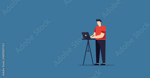 Focused person working on a laptop at a standing desk setup. Represents remote work, productivity, technology, and modern professional life. Ideal for business, education, or lifestyle themes.