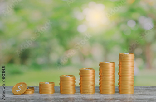 gold coin stacking 3D render on wodden board with photo of green blur nature background for business concept financial, banking and investment with money growth success.