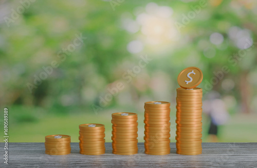 gold coin stacking 3D render on wodden board with photo of green blur nature background for business concept financial, banking and investment with money growth success.