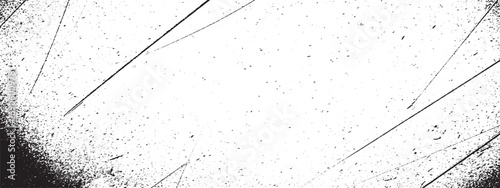 Grunge texture with distressed overlay and scattered dust particles forming black and white abstract background