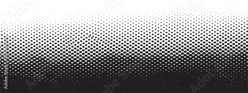 Halftone dot pattern fading from black to white creating textured graphic design element