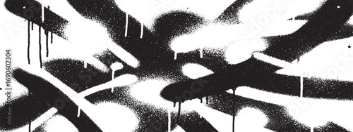Black and white spray paint splatter forming urban art and graffiti inspired abstract pattern