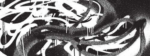 Energetic graffiti tags and scribbles creating expressive urban art composition in black and white