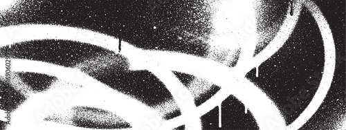 Bold graffiti spray paint strokes in white on black background creating abstract urban art composition