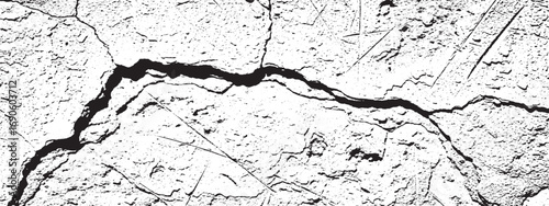 Closeup of cracked surface with fine lines and scratches creating black and white textured composition
