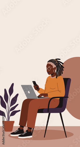 Elderly Black woman with dreadlocks uses laptop and smartphone, embodying modern senior living, remote work, and digital connectivity in a relaxed home environment.