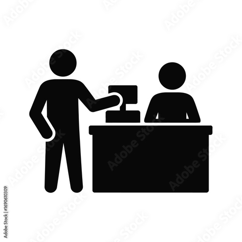 Customer service interaction at a counter with a computer