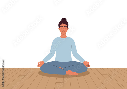 Woman in Lotus Position Meditating on Wooden Floor