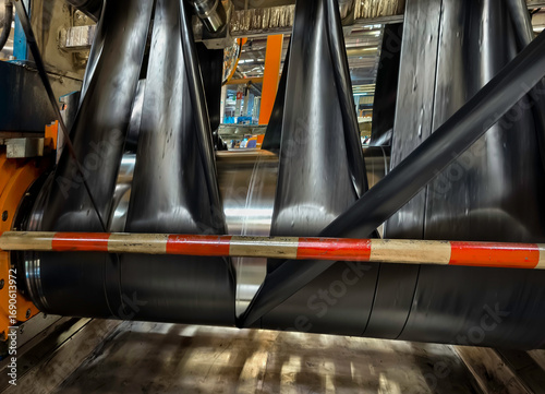 Rubber, oil and chemicals are mixed homogeneously on the rubber mixer. Rubber producing.