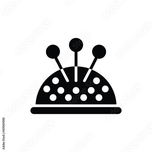 Black and white icon of a pincushion with pins