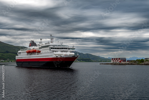 Big Cruise Ship And Ferry Arrives In The Harbor Of Stokmarknes At The Lofoten In Norway