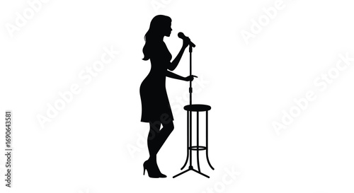 a woman singing into microphone beside stool silhouette
