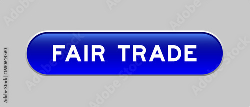 Blue color capsule shape button with word fair trade on gray background