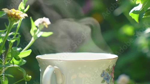Herbal Steam Rising from Teacup in Botanical Setting