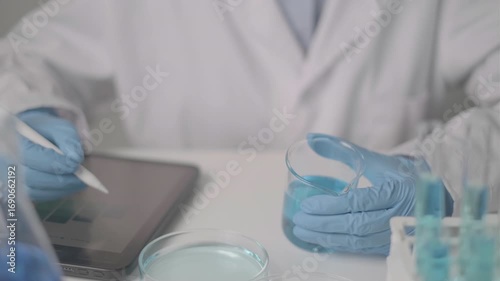 Professional Asian woman scientist chemist technician experiment research in chemistry laboratory data analysis result report scientific innovation document