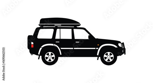 a black suv with roof rack parked outdoors