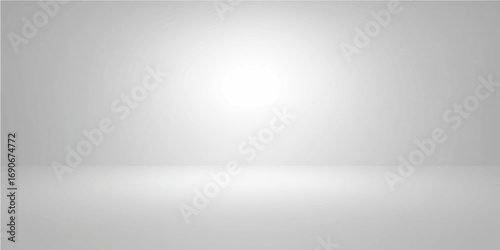 Empty room with a spotlight shining on a brushed steel wall