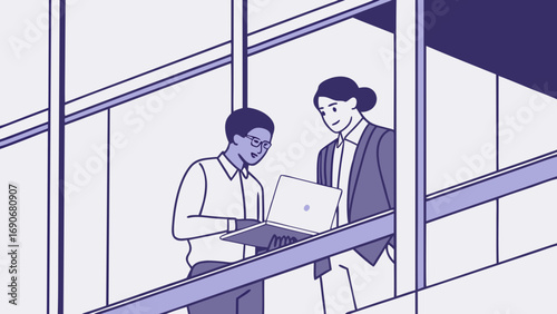 Two colleagues collaborating on a laptop at an office window.