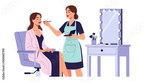 Professional makeup artist applying cosmetics to a seated woman in a beauty salon with a lighted vanity mirror