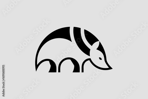 Monochrome armadillo emblem with a minimalist silhouette and geometric shell — a refined vector logo and icon ideal for wildlife conservation, boutique crafts, and nature-inspired branding.