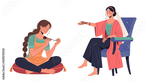 Two young women in traditional indian clothing engaged in sewing and crafting activities together indoors