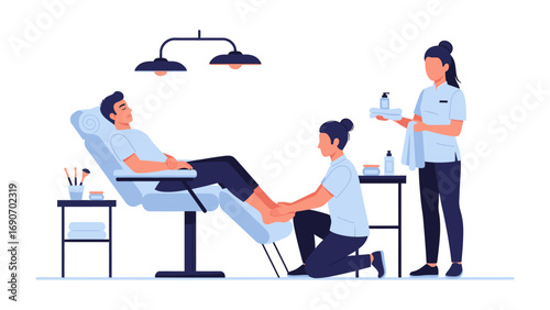 Professional spa technician carefully massaging and pampering a male client s foot and leg while another therapist prepares beauty products in a clean modern salon setting