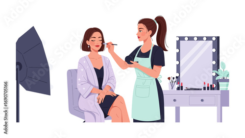 Professional makeup artist applying cosmetics to a model in a studio with lighting and a vanity mirror setup