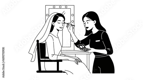 Young woman applying makeup to bride wearing veil in front of mirror preparing for wedding day ceremony