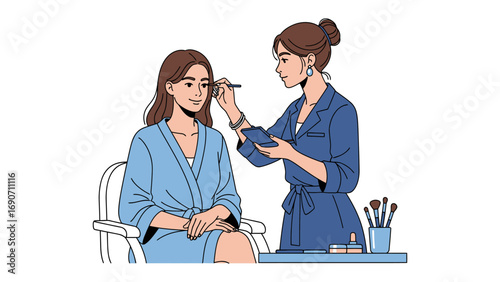 Professional makeup artist applying cosmetics to a young woman s face while she sits in a chair wearing a robe