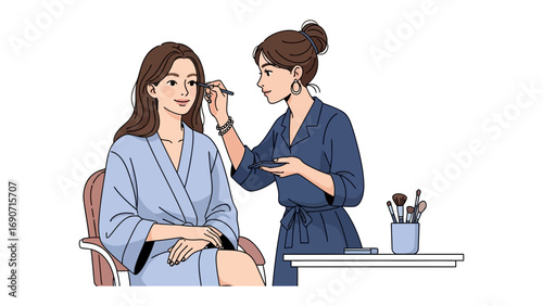 Professional makeup artist applying eyeshadow to a young woman wearing a blue robe in a beauty salon setting