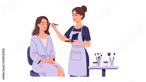 Professional makeup artist applying cosmetics to a woman s face with brushes and palette in a beauty salon setting