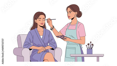 Professional makeup artist applying cosmetic makeup to a seated woman in a robe with a makeup palette and brush