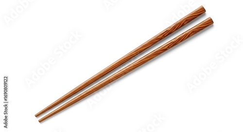 A pair of wooden chopsticks lying diagonally on a white surface.