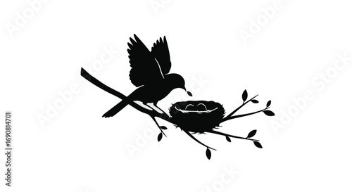Silhouette of a bird feeding chicks in a nest on a branch