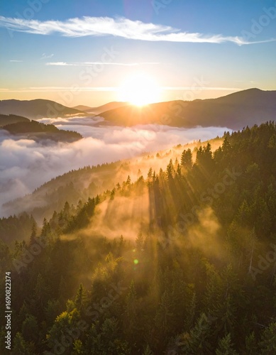 cinematic drone shot of a misty, forested mountain range at sunrise, with light ray 
