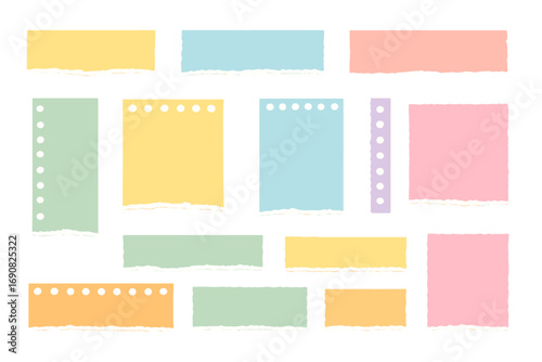 Colorful collection of torn paper scraps with ripped edges from a spiral notebook isolated on a white background