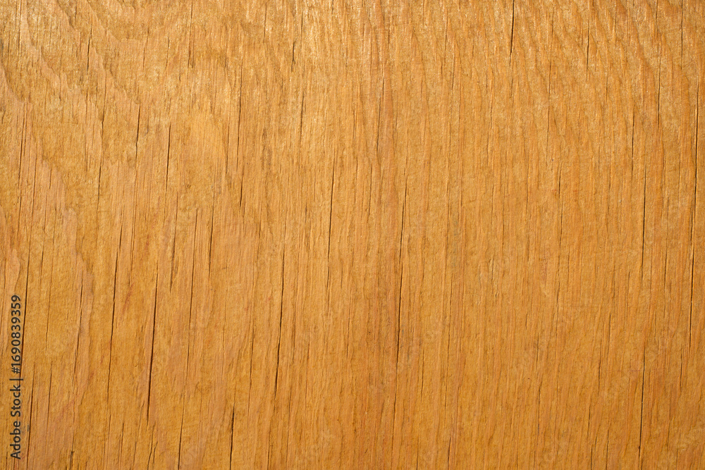 Naklejka premium A photo of the texture of light wood with small cracks.The texture of an old wooden background.