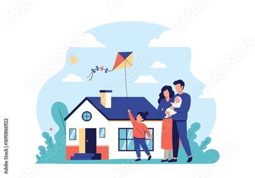 Family enjoying a sunny day flying a kite near their new home