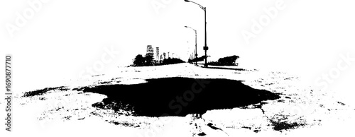Urban street landscape featuring grunge black and white puddle silhouette