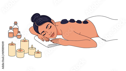 Relaxed woman receiving a soothing hot stone massage therapy treatment with candles and essential oils for ultimate wellness and rejuvenation