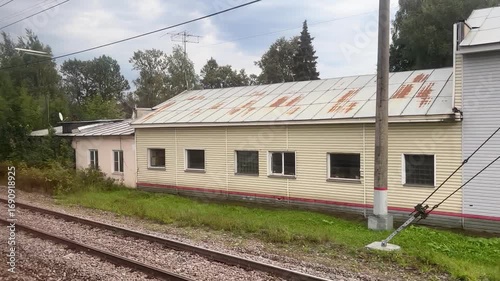 Wallpaper Mural Tranquil Rail Yard With Rusting Train Cars and a Serene Countryside Backdrop Torontodigital.ca