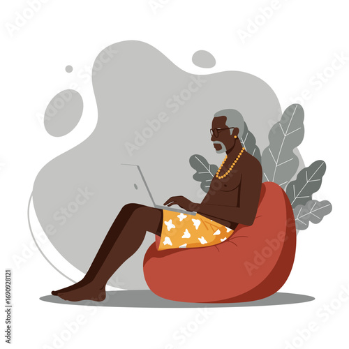 Elderly Black man enjoying remote work or leisure on a laptop while relaxing comfortably in a bean bag chair. Ideal for travel, lifestyle, or technology concepts.