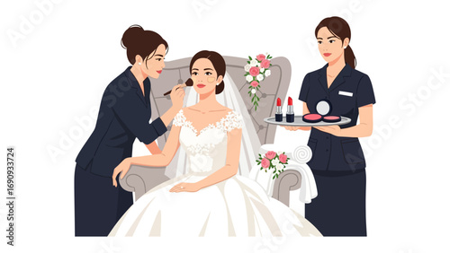 Bride receiving professional makeup application from a skilled artist while an assistant holds a tray of cosmetics and beauty products